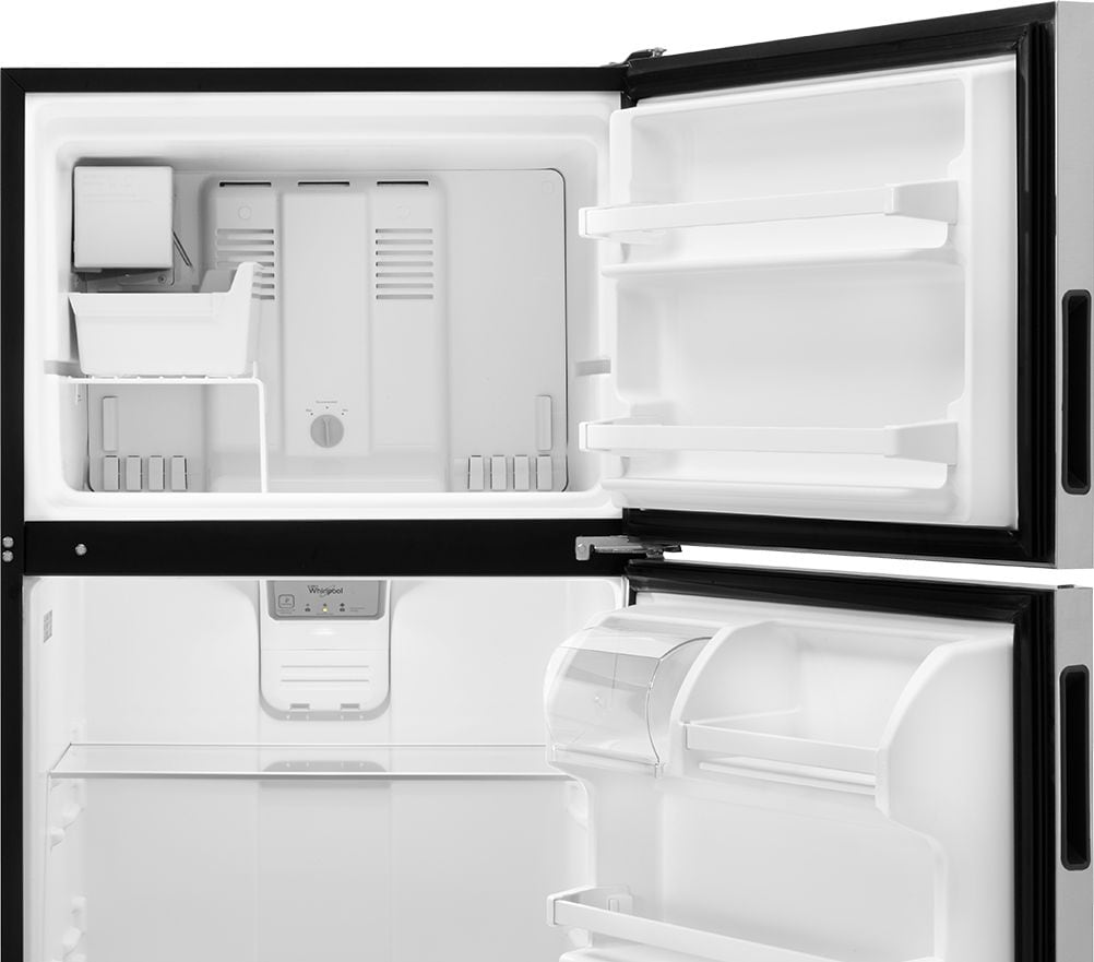 Top-freezer refrigerator from Whirlpool with open doors.