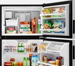Top-freezer refrigerator from Whirlpool with open doors.