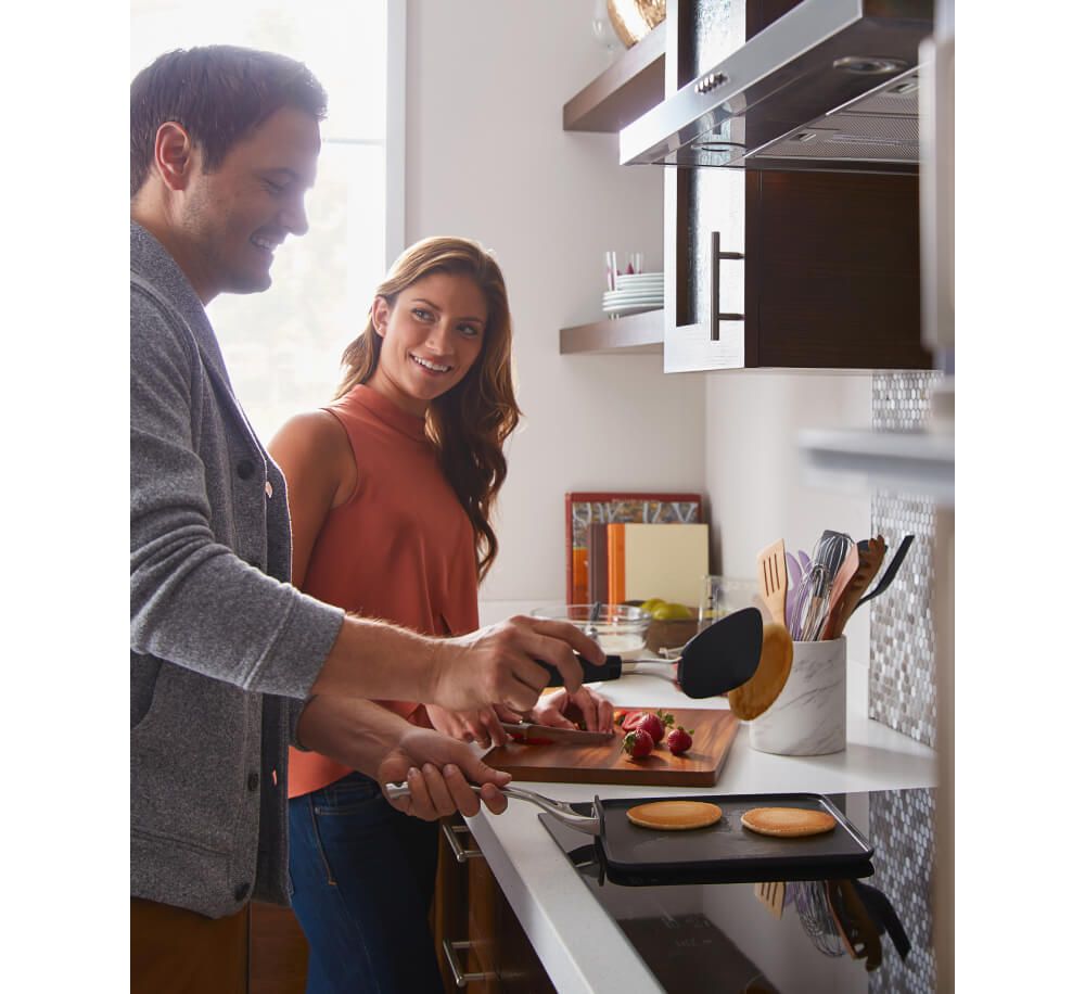 Family cooking in kitchen