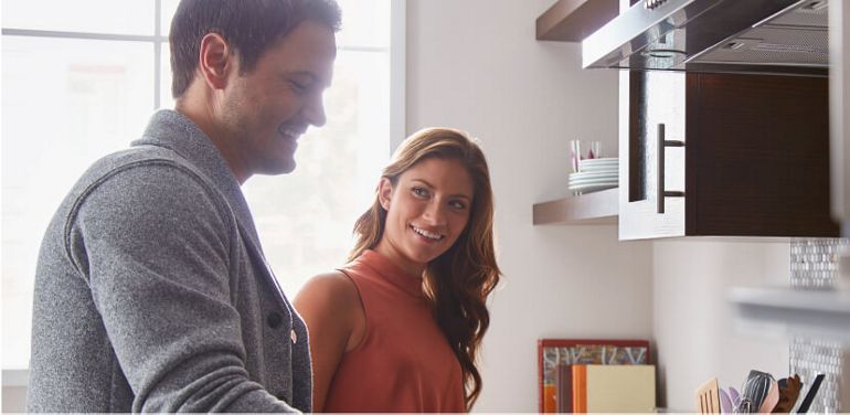 Family cooking in kitchen