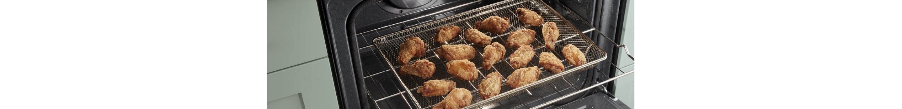 Chicken wings air frying in a Whirlpool® Standard Electric Range