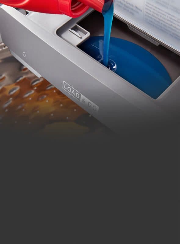 Pouring detergent into the Load & Go™ Dispenser