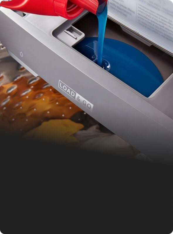 Pouring detergent into the Load & Go™ Dispenser