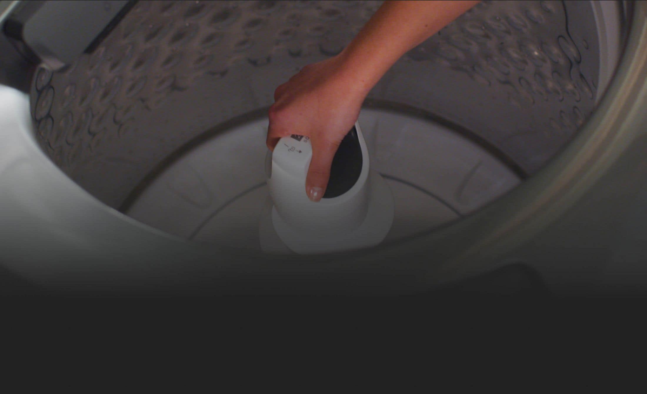 A person removing the 2 in 1 Removable Agitator
