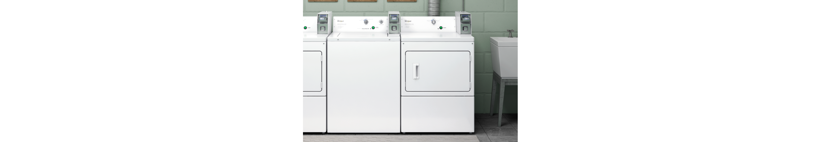 A Whirlpool® commercial laundry set in a laundry room.