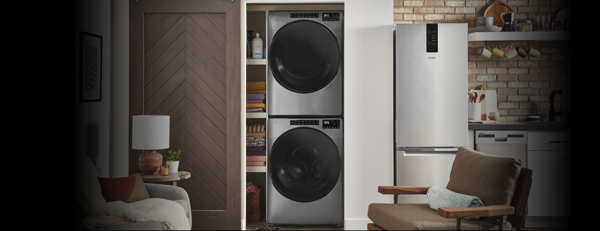 A front load washer and dryer set under a counter in the laundry room.