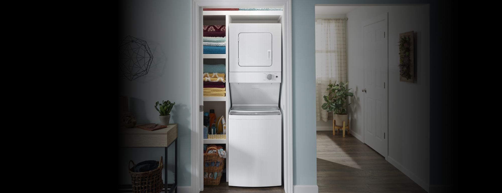 A stackable front load washer and dryer in a laundry room.