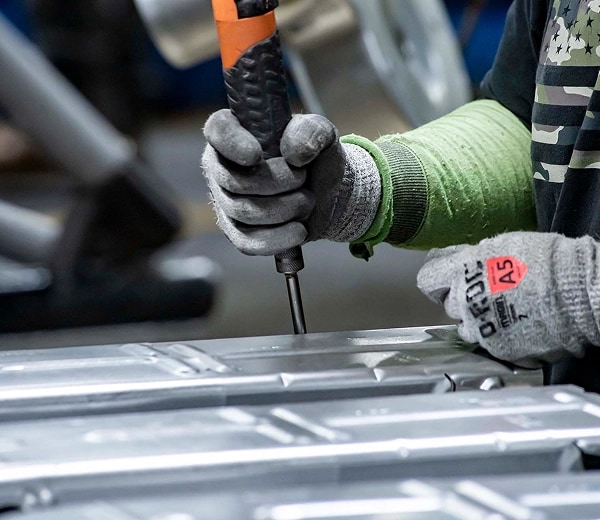 A person assembling an appliance