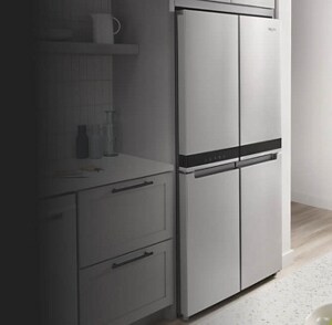 A bright, white kitchen with a 4-door refrigerator