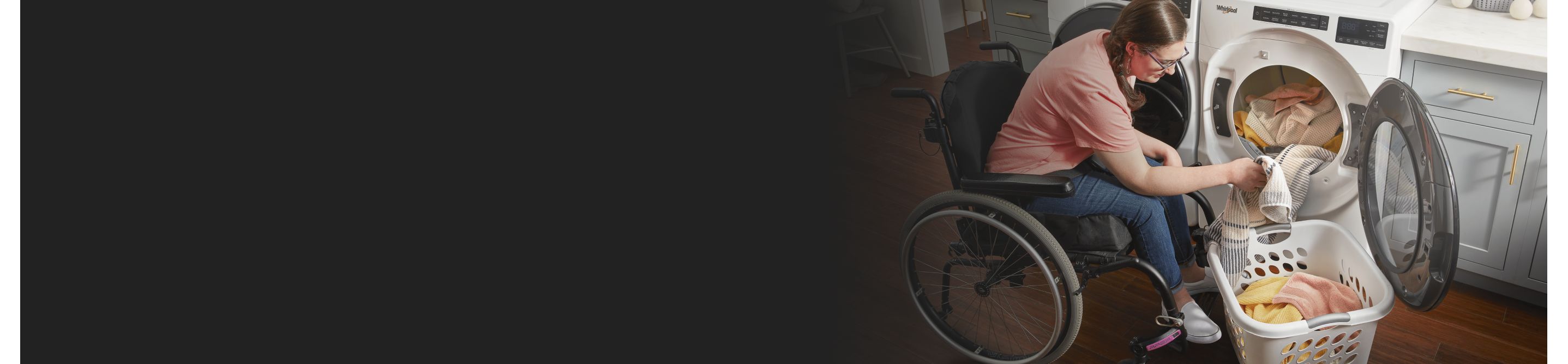 Person in a wheelchair using a Whirlpool® dryer