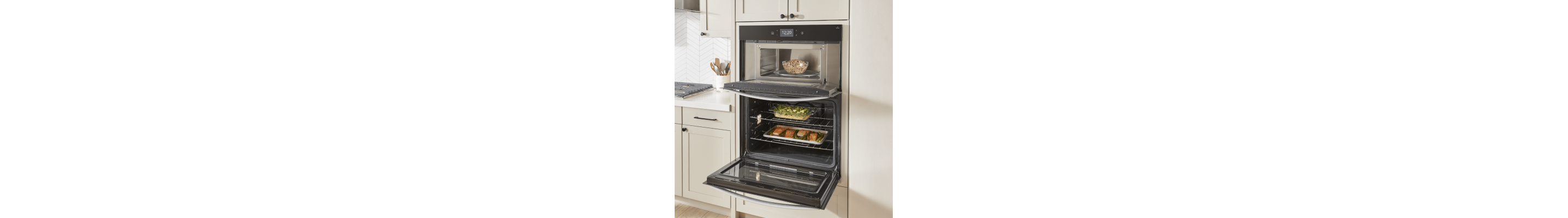 Three dishes cooking in a double oven