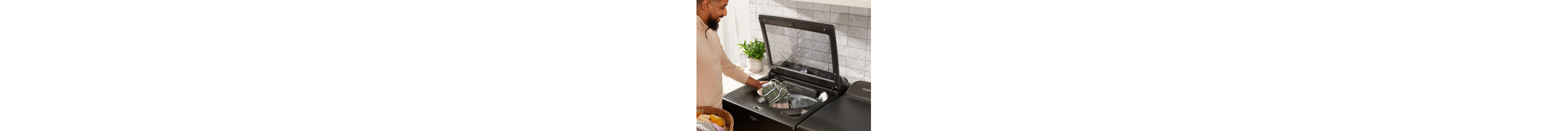 Person loading a top load washer