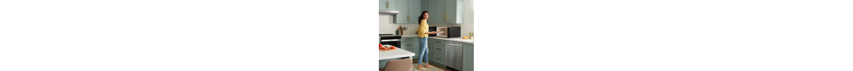 Person standing in front of a countertop microwave