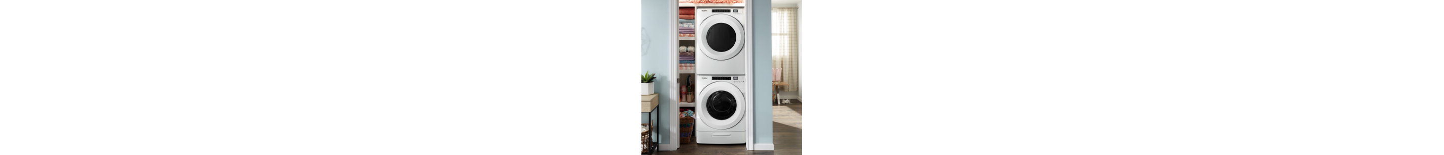 White stacked front load washer and dryer set inside a closet