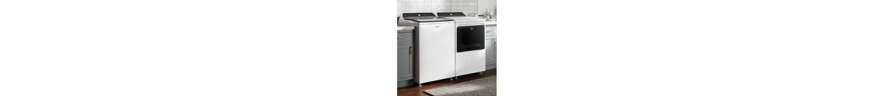 Top load washer and dryer set in a laundry room
