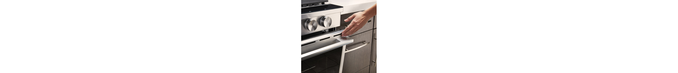 A person closing an oven door