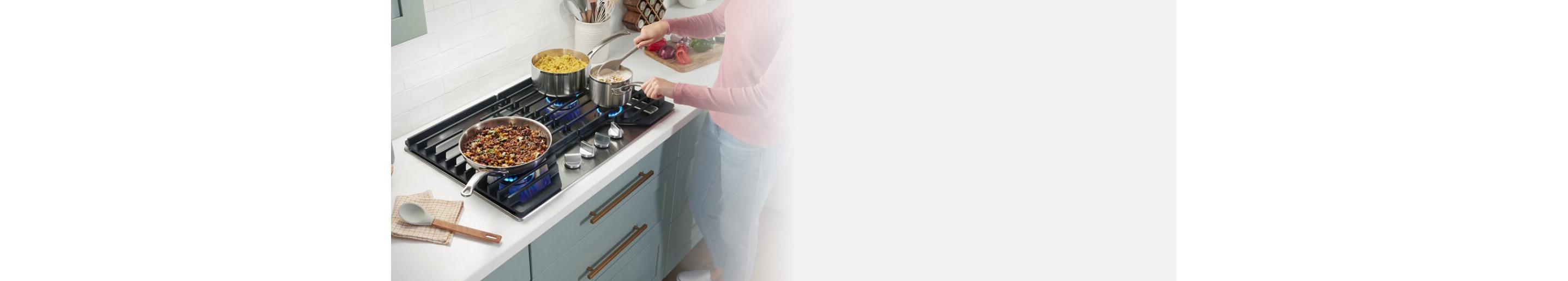 Person cooking on a gas cooktop