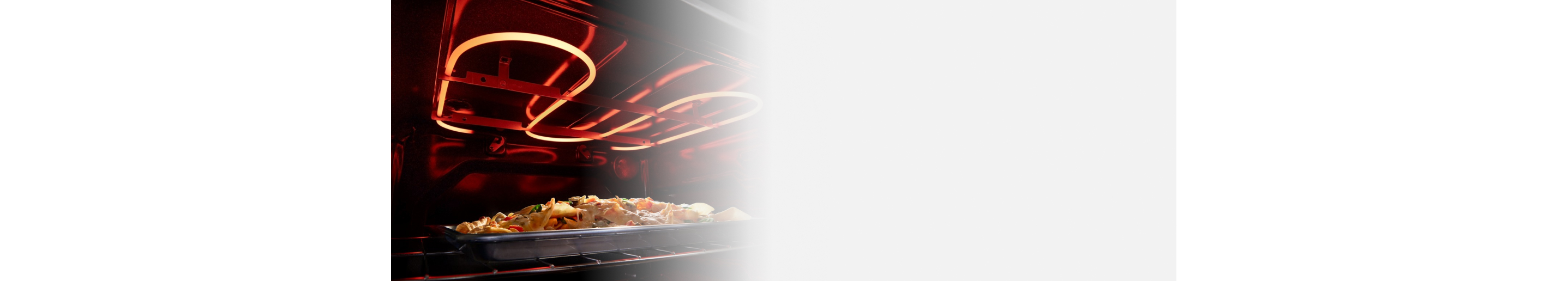 Food on a baking sheet inside an oven