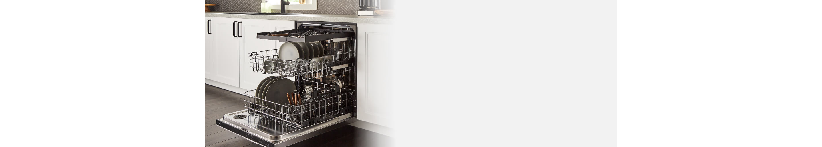 Open Whirlpool® 3rd Rack Dishwasher loaded with dishes