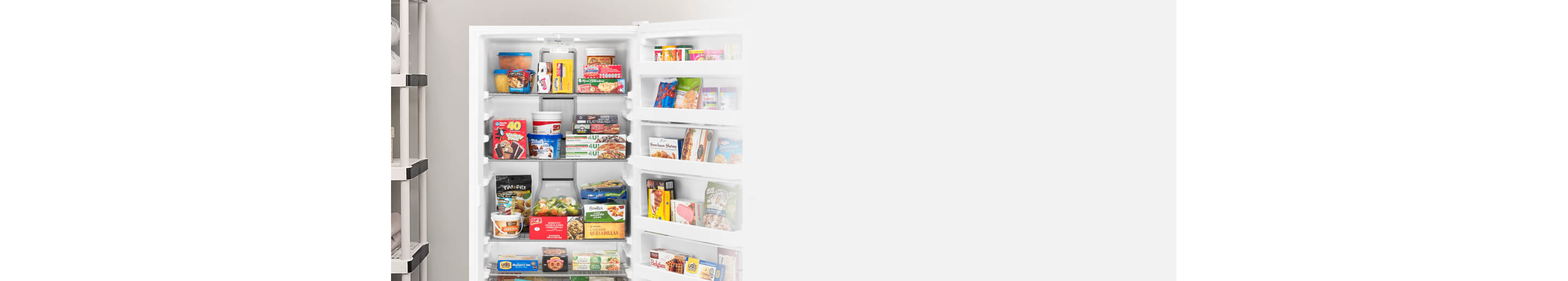 An upright freezer stocked with packaged food