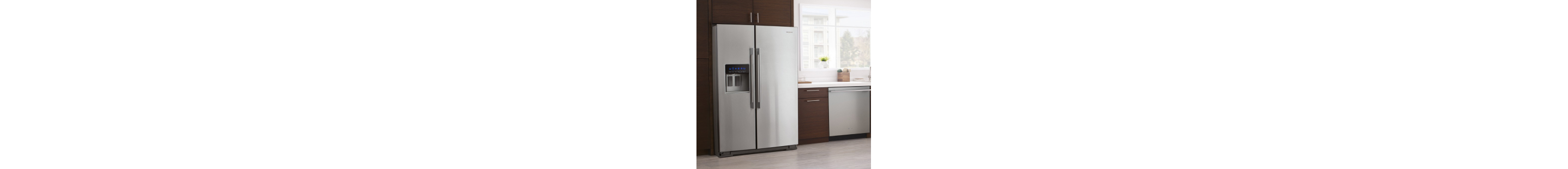 A Whirlpool® stainless steel refrigerator surrounded by brown cabinetry