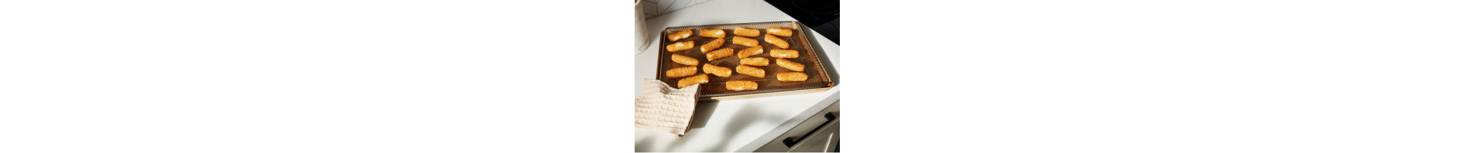 A pan with mozzarella sticks on it