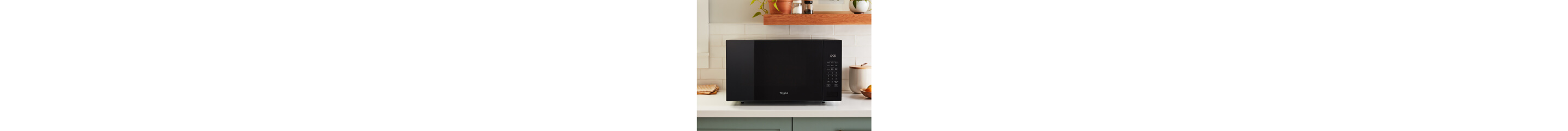 A black Whirlpool® Countertop Microwave