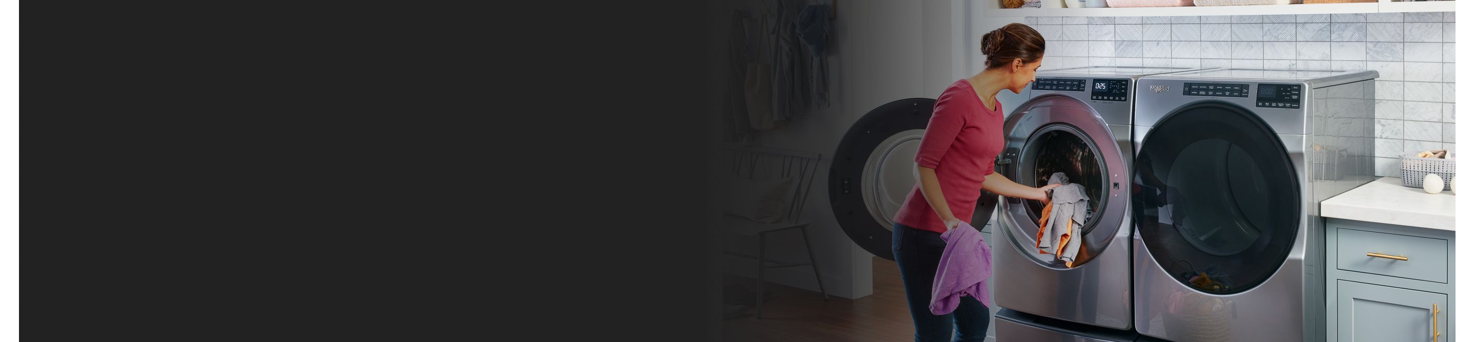 Person loading items into a front load washing machine