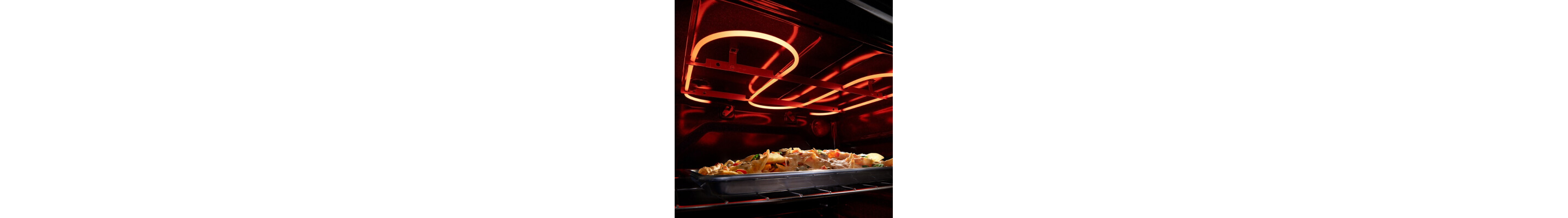 Top oven heating element baking food inside the oven