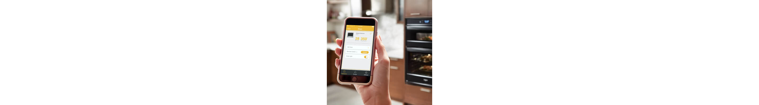 Person holding up phone with app open to wall oven settings