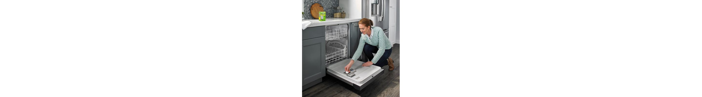 Person putting dishwasher cleaner in dishwasher