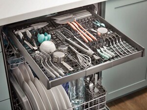 An open dishwasher with a loaded third rack