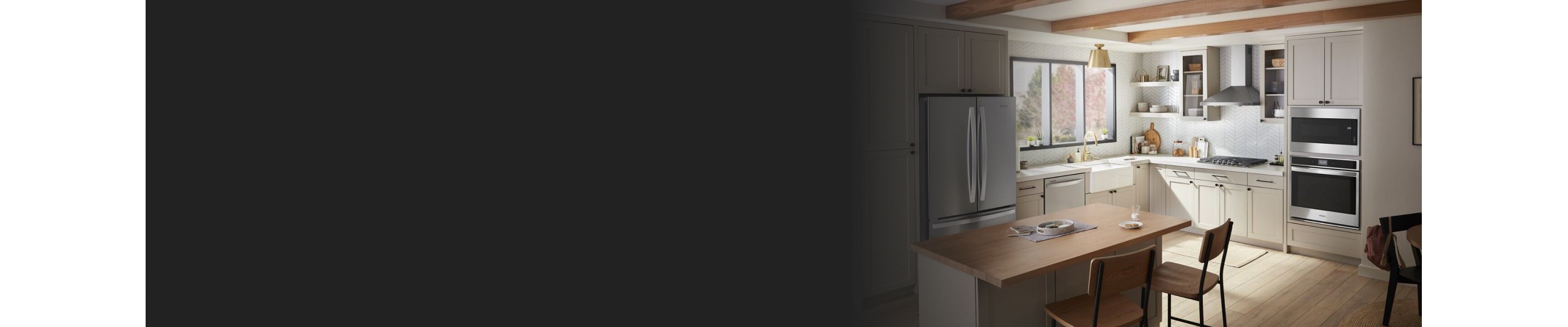 White kitchen featuring Whirlpool® stainless steel appliances
