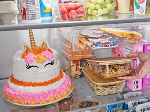 Person placing leftovers in a refrigerator