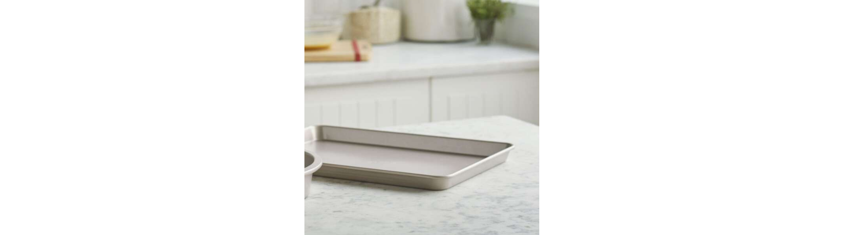 Empty baking sheet on a granite countertop