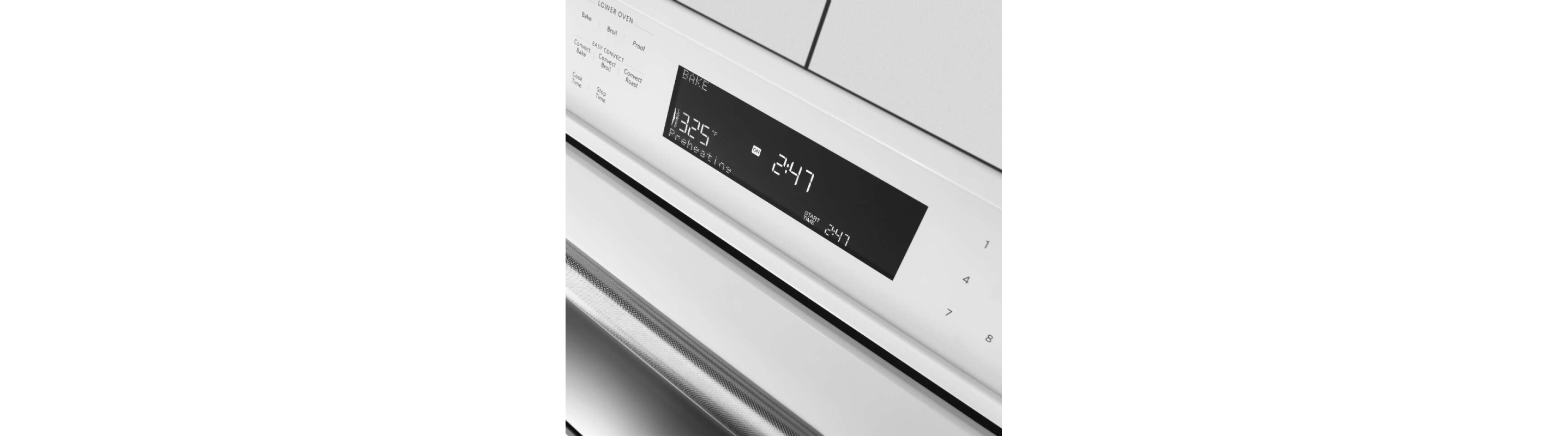Close-up of oven control panel displaying time and oven temperature