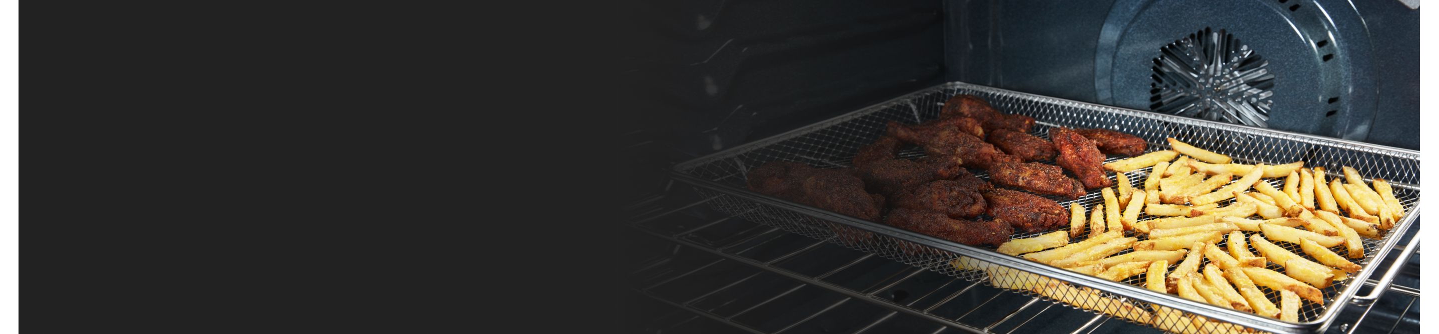 Chicken and fries in an air fryer basket