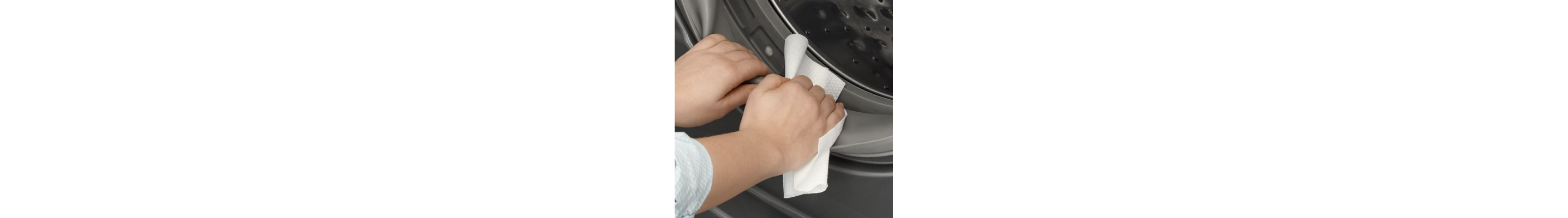 Person wiping rubber seal on washing machine door