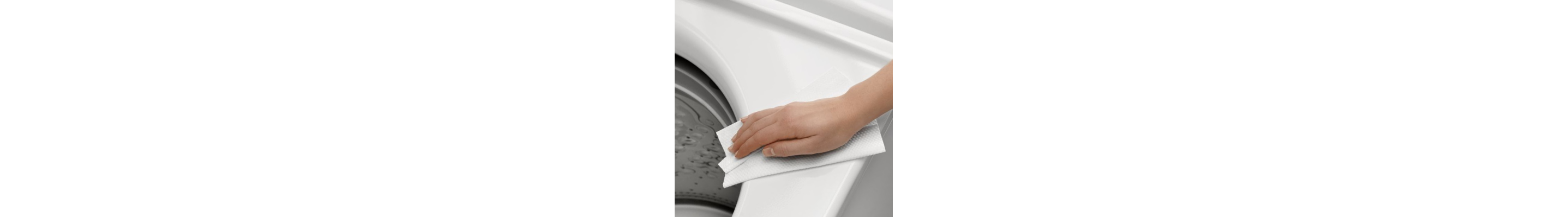 Person wiping outside of washing machine