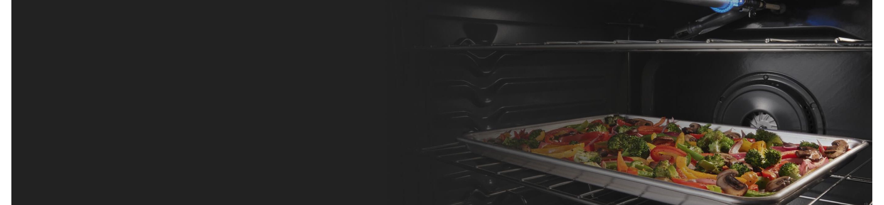 Veggies roasting on a pan in a convection oven