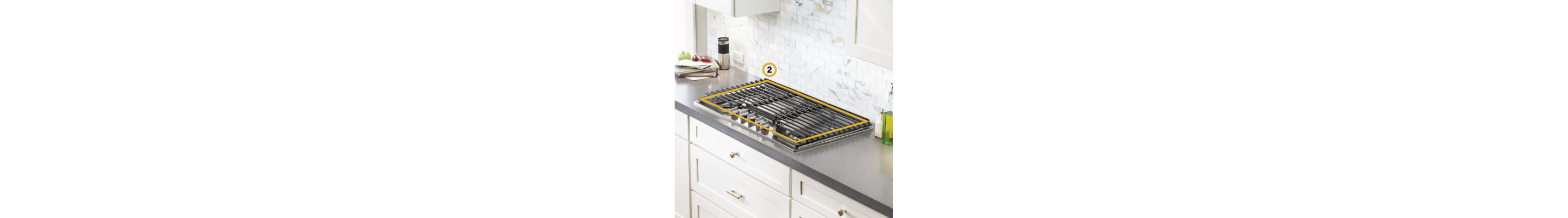 Gas cooktop set into gray countertop with perimeter noted to measure cooktop cutout space