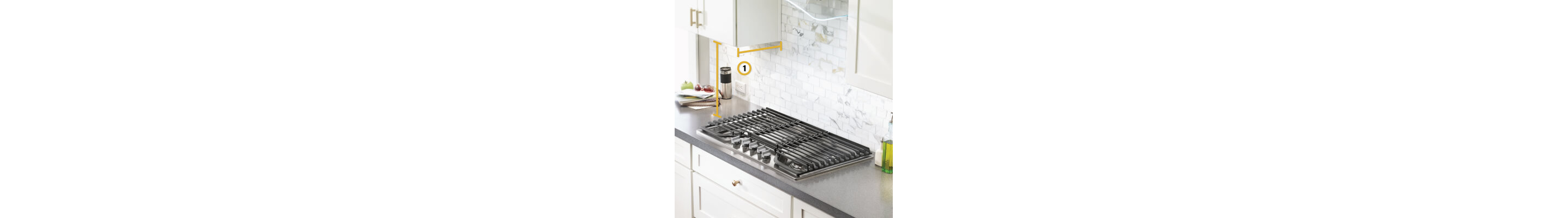 Gas cooktop set into gray countertop with measurements noted from below cabinets