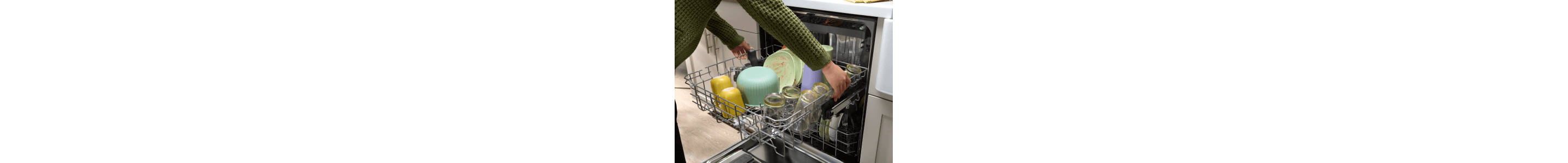 Person adjusting a dishwasher rack