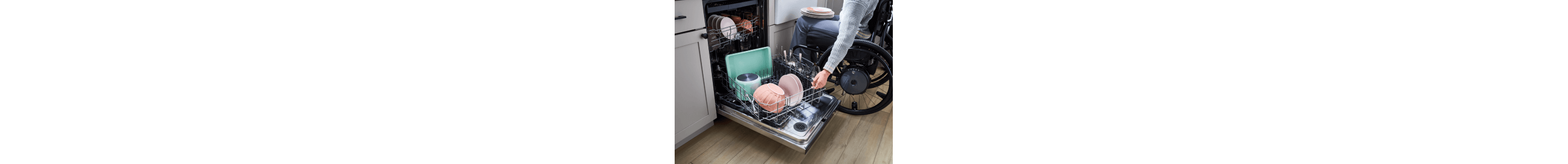 Person rotating a Whirlpool brand Spin&Load Dishwasher Rack