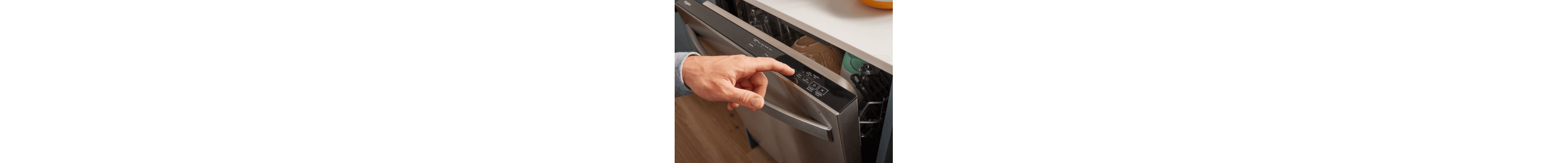 Person selecting a cycle on a top control dishwasher