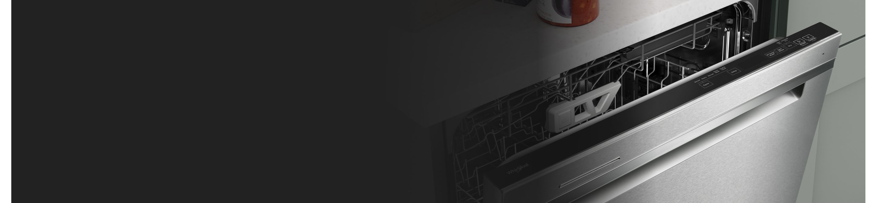 A dishwasher door slightly ajar
