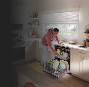 A man unloading his dishwasher