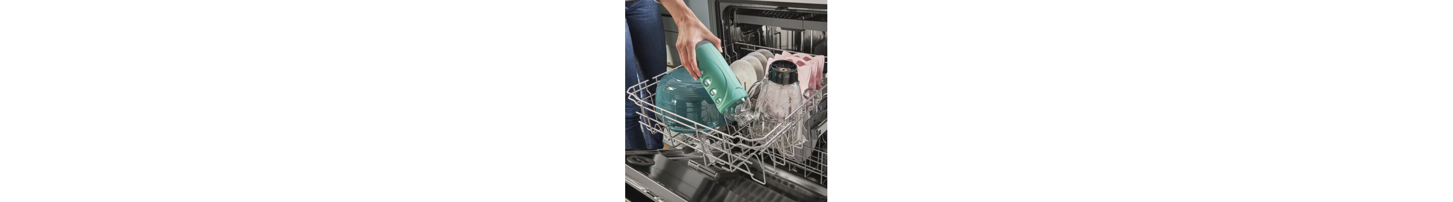 Person unloading a water bottle from the dishwasher