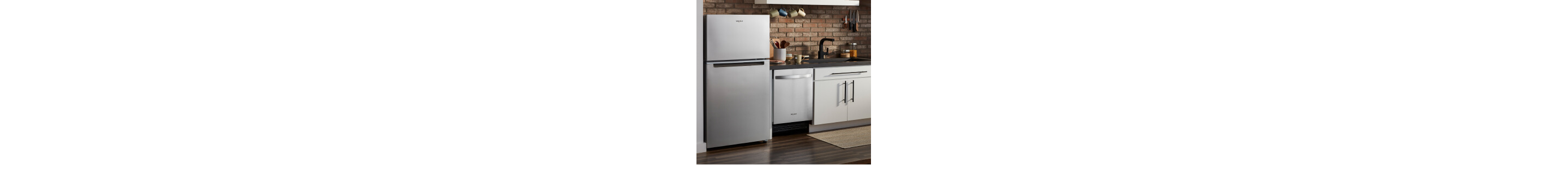 A stainless steel Whirlpool® refrigerator and dishwasher in a kitchen