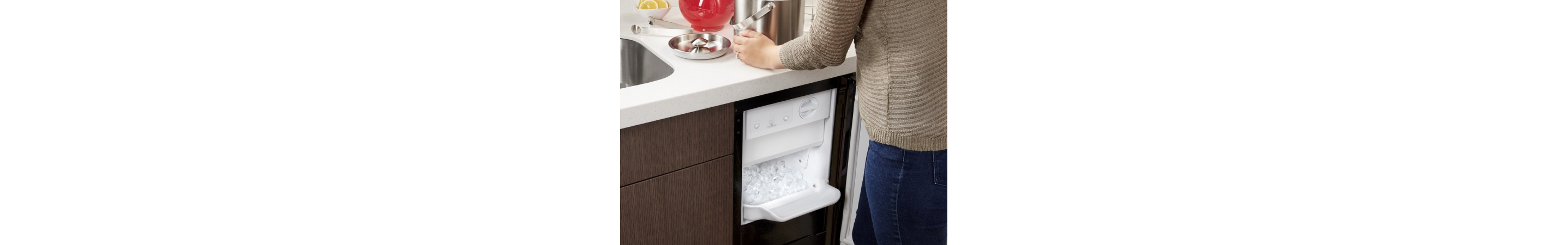 Ice maker underneath a kitchen counter